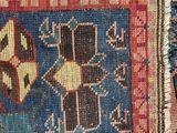 a close up of a rug with a cat on it