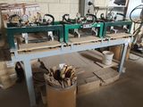 a table with a bunch of tools on it in a room