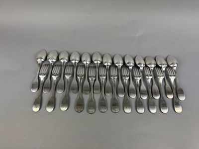 a lot of spoons and forks on the table