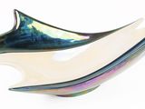 a glass bowl that is shaped like a dolphin