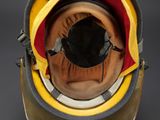 yellow and black helmet with red lining on a black background
