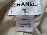 a label on a chanel dress with a white background