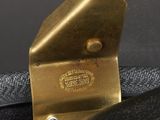 a black bag with a gold buckle on it
