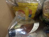 a box full of food and a bottle of wine in it