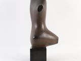 bronze sculpture of a woman ' s head on a black base