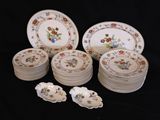 a lot of plates that are sitting on a table