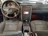 a picture of the interior of a car with a steering wheel and dashboard