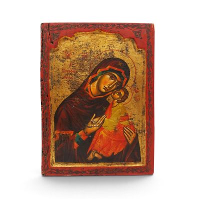 une icône représentant la Vierge Marie et l'Enfant Jésus sur un fond rouge et or
