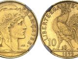 a gold coin with a woman ' s head and a rooster on it
