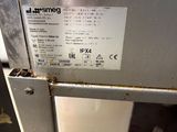 a close up of a stainless steel refrigerator with a label on it