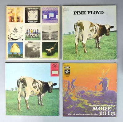 trois pochettes d'albums de Pink Floyd sur une table