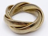 a close up of two gold bracelets on a white surface
