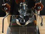 an image of a coffee machine on a wooden table