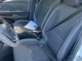 the interior of a car with the front seats folded down