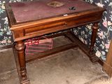 a wooden table with a book on top of it