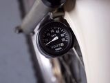 a close up of a bike tire with a speedometer on it