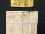 a piece of paper with a gold bar on top of it