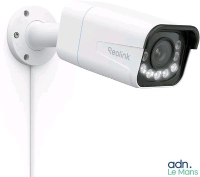 a white security camera attached to a white wall