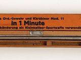 une image représentant un tube métallique avec une boîte en bois en arrière-plan
