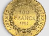 a close up of a gold coin with a wreath on it