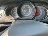 the dashboard of a car with a steering wheel and gauges