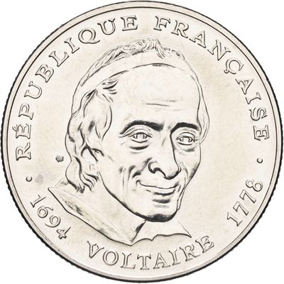 une vieille pièce sur laquelle est représenté le visage d'un homme