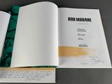 a close up of an open book with writing on it