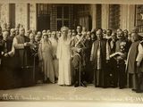 an old photo of a group of people posing for a picture