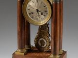 a wooden clock that is sitting on a table