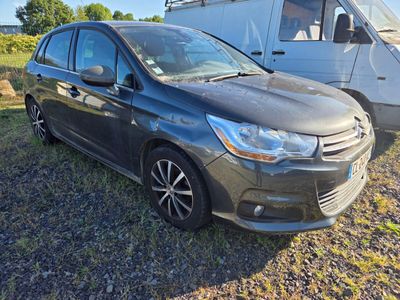 a picture of a small car parked in front of a camper