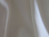 a close up picture of a white cloth with a black stripe