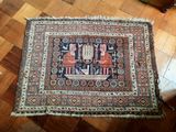 a rug on the floor in a room with a wooden floor