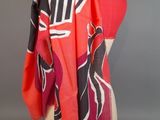 an image of a red and black scarf on a mannequin