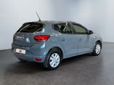 the rear view of a grey car in a showroom