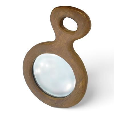 the magnifying glass is shaped like a wooden object with a wooden handle