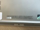 a laptop that has a small battery attached to it