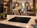 une photo d'une cuisine avec une plaque de cuisson et une salle à manger en arrière-plan