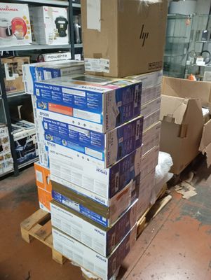 a stack of boxes sitting on a pallet in a warehouse
