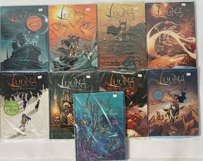 a lot of books that are sitting on a table