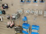 a wall of electronics on display in a store