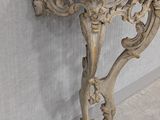 a white marble table with a marble top on it