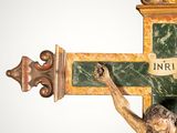 a statue of jesus on the cross on a white background