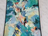 painting on the wall of a living room with a painting of a fish