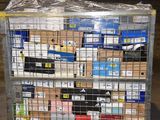 a metal cart with many boxes on top of it