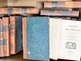 a box full of old books sitting on top of a table