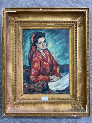 painting of a woman reading a book in a gold frame