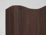 wooden sculpture of a wave on top of a white surface