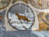 a picture of a quilt with a picture of a fox and other animals on it