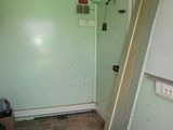 a door that is leaning against the wall in the room