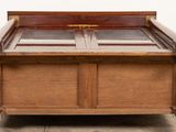 a bed that has a wooden frame on top of it